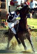 18 September 2000; Brazil's Luiz Augusto Faria attempts to stay on his mount Hunefer after clearing the water jump during the Cross Country discipline of the Team 3 Day Eventing. Horsley Park Equestrian Centre, Sydney West, Australia. Photo by Brendan Moran/Sportsfile
