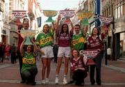 22 September 2000; Models Lorraine Mannion, Galway jersey, (right) and Jennifer Langan, Kerry jersey pictured with Galway and Kerry Supporters, all holding Sam Maguire replicas which will be distributed to supporters going to the Bank of Ireland Millennium Football Final between Galway and Kerry. Picture credit: Damien Eagers/Sportsfile
