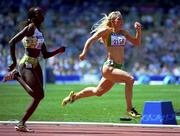 22 September 2000; Ireland's Sarah Reilly, right, sprints clear of Senegal's Aminata Diouf on her way to qualifying for the second round of the Women's 100m heats. Stadium Australia, Sydney Olympic Park, Homebush Bay, Sydney, Australia. Photo by Brendan Moran/Sportsfile