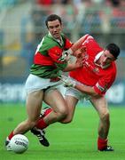 24 September 2000: Alan Burke of Mayo in action against Kieran Murphy of Cork during the All Ireland Minor Football Championship Final match between Cork and Mayo at Croke Park in Dublin. Photo by Ray McManus/Sportsfile