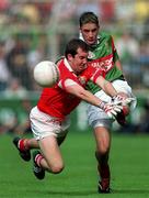 24 September 2000: Conor Moran of Mayo in action against Mark O'Connor of Cork during the All Ireland Minor Football Championship Final match between Cork and Mayo at Croke Park in Dublin. Photo by Ray McManus/Sportsfile