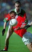 24 September 2000:  Conrad Murphy of Cork in action against Enda Devenney of Mayo during the All Ireland Minor Football Championship Final match between Cork and Mayo at Croke Park in Dublin. Photo by Ray McManus/Sportsfile