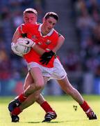 24 September 2000: Kieran Murphy of Cork is tackled by Edmond Barrett of Mayo during the All Ireland Minor Football Championship Final match between Cork and Mayo at Croke Park in Dublin. Photo by Ray McManus/Sportsfile