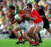 24 September 2000: Conor Moran of Mayo is tackled by Mark O'Connell of Cork during the All Ireland Minor Football Championship Final match between Cork and Mayo at Croke Park in Dublin. Photo by Ray McManus/Sportsfile