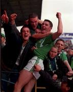17 September 2000; Limerick's Stephen Lucey celebrates with fans after the final whistle following the All Ireland Under-21 Hurling Championship Final match between Galway and Limerick at Semple Stadium in Thurles, Tipperary. Photo by Damien Eagers/Sportsfile