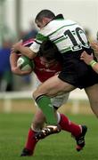 23 September 2000; Anthony Foley of Munster is tackled by Eric Elwood of Connacht during the Guinness Interprovincial Rugby Championship match between Connacht and Munster at the Sportsground in Galway. Photo by Matt Browne/Sportsfile