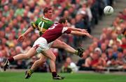 24 September 2000; Dara O'Cinneide of Kerry clears ahead of Gary Fahey of Galway during the Bank of Ireland All-Ireland Football Championship Final Replay between Galway and Kerry at Croke Park in Dublin. Photo by Ray McManus/Sportsfile