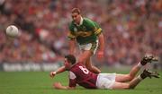 24 September 2000; Sean O'Domhnaill of Galway passes the ball away ahead of Maurice Fitzgerald of Kerry during the Bank of Ireland All-Ireland Football Championship Final Replay between Galway and Kerry at Croke Park in Dublin. Photo by Ray McManus/Sportsfile