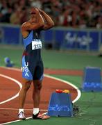 23 September 2000; USA's Maurice Greene celebrates winning the Gold Medal in the Men's 100m Final. Stadium Australia, Sydney Olympic Park. Homebush Bay, Sydney, Australia.  Photo by Brendan Moran/Sportsfile