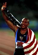 23 September 2000; USA's Maurice Greene celebrates winning the Gold Medal in the Men's 100m Final. Stadium Australia, Sydney Olympic Park. Homebush Bay, Sydney, Australia. Photo by Brendan Moran/Sportsfile