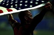 23 September 2000; USA's Maurice Greene celebrates winning the Gold Medal in the Men's 100m Final. Stadium Australia, Sydney Olympic Park. Homebush Bay, Sydney, Australia. Photo by Brendan Moran/Sportsfile