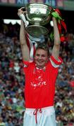 24 September 2000: Cork captain James Masters lifting the cup following the All Ireland Minor Football Championship Final match between Cork and Mayo at Croke Park in Dublin. Photo by Ray McManus/Sportsfile