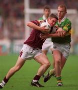 24 September 2000;  Paul Clancy of Galway is tackled by Liam Hassett of Kerry during the Bank of Ireland All-Ireland Football Championship Final Replay between Galway and Kerry at Croke Park in Dublin. Photo by Damien Eagers/Sportsfile