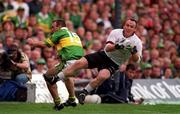 24 September 2000; Martin McNamara of Galway holds on to the ball despite the attentions of John Crowley of Kerry during the Bank of Ireland All-Ireland Football Championship Final Replay between Galway and Kerry at Croke Park in Dublin. Photo by Damien Eagers/Sportsfile