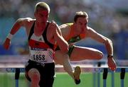 23 September 2000; Ireland's Peter Coghlan, right, follows behind Germany's Falk Balzer during the Men's 110m Hurdles. Stadium Australia, Sydney Olympic Park. Homebush Bay, Sydney, Australia. Photo by Brendan Moran/Sportsfile