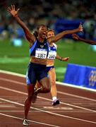 23 September 2000; USA's Marion Jones celebrates winning Gold in the Women's 100m Final. Stadium Australia, Sydney Olympic Park. Homebush Bay, Sydney, Australia.  Photo by Brendan Moran/Sportsfile