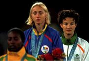 25 September 2000;  Ireland's Sonia O'Sullivan looks on after receiving her silver medal in the Women's 5000m as Gold Medallist Gabriela Szabo, centre, Romania and Bronze Medallist Gete Wami, Ethiopia, listen to the Romanian National Anthem. Stadium Australia, Sydney Olympic Park. Homebush Bay, Sydney, Australia. Photo by Brendan Moran/Sportsfile