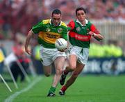 28 September 1997; Pa Laide, Kerry, is tackled by Noel Connelly, Mayo. Kerry v Mayo, All Ireland Final, Croke Park, Dublin, Football. Picture credit; Ray McManus / SPORTSFILE