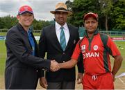 23 July 2015; Nicolaas Scholtz, Namibia captain, shakes hands with Sultan Ahmed, Oman, alongside match referee Graeme LaBrooy. ICC World Twenty20 Qualifier 2015, Play-Off 4, Oman v Namibia. Malahide, Dublin. Picture credit: Cody Glenn / ICC / SPORTSFILE