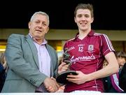 24 July 2015; Pictured is Kevin Molloy, Customer Relationship Manager for Electric Ireland, proud sponsor of the GAA All-Ireland Minor Championships, presenting Ciarán Brady from Galway with the Player of the Match award for his outstanding performance in the Electric Ireland Connacht Minor Football Championship Final replay. Throughout the Championship fans can follow the action, support the Minors and be a part of something major through the hashtag #ThisIsMajor. Electric Ireland Connacht GAA Football Minor Championship Final Replay, Galway v Sligo. Tuam Stadium, Tuam, Co. Galway. Picture credit: Piaras Ó Mídheach / SPORTSFILE