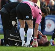 24 July 2015; Jason McGuinness, St Patrick's Athletic, receives mediical attention after a clash with Sligo Rovers goalkeeper Richard Brush resulting in the St. Patrick's Athletic player being substituted. SSE Airtricity League Premier Division, Sligo Rovers v St Patrick's Athletic. The Showgrounds, Sligo. Picture credit: David Maher / SPORTSFILE