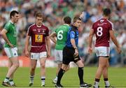 25 July 2015; Referee Padraig Hughes after issuing Ryan McCluskey, Fermanagh, No. 6, with a black card late in the first half. GAA Football All-Ireland Senior Championship, Round 4A, Fermanagh v Westmeath. Kingspan Breffni Park, Cavan. Picture credit: Oliver McVeigh / SPORTSFILE