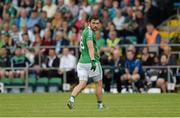 25 July 2015; Ryan McCluskey, Fermanagh, leaves the field after referee Padraig Hughes after issued him with a black card late in the first half. GAA Football All-Ireland Senior Championship, Round 4A, Fermanagh v Westmeath. Kingspan Breffni Park, Cavan. Picture credit: Oliver McVeigh / SPORTSFILE
