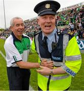 25 July 2015; Peter McGrath, Fermanagh manager, celebrates with Garda Joe O'Connor after the game. GAA Football All-Ireland Senior Championship, Round 4A, Fermanagh v Westmeath. Kingspan Breffni Park, Cavan. Picture credit: Oliver McVeigh / SPORTSFILE