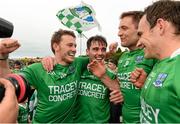 25 July 2015; Declan McCusker, Barry Mulrone, Richard O'Callaghan and Paul McCusker, Fermanagh, celebrate after the game. GAA Football All-Ireland Senior Championship, Round 4A, Fermanagh v Westmeath. Kingspan Breffni Park, Cavan. Picture credit: Oliver McVeigh / SPORTSFILE