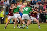 25 July 2015; Paddy Holloway and John Gilligan, Westmeath, in dispute with Richard O'Callaghan and Sean Quigley, Fermanagh, near the end of the game. GAA Football All-Ireland Senior Championship, Round 4A, Fermanagh v Westmeath. Kingspan Breffni Park, Cavan. Picture credit: Oliver McVeigh / SPORTSFILE