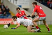 25 July 2015; Niall Kelly, Kildare, in action against Jamie O'Sullivan and James Loughey, 4, Cork. GAA Football All-Ireland Senior Championship, Round 4A, Kildare v Cork. Semple Stadium, Thurles, Co. Tipperary. Picture credit: Piaras Ó Mídheach / SPORTSFILE