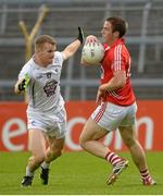 25 July 2015; Colm O'Neill, Cork, in action against Peter Kelly, Kildare. GAA Football All-Ireland Senior Championship, Round 4A, Kildare v Cork. Semple Stadium, Thurles, Co. Tipperary. Picture credit: Piaras Ó Mídheach / SPORTSFILE