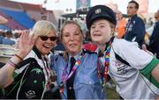 24 July 2015; Team Ireland’s Rita Quirke, left, a member of Moore Abbey Special Olympics Club, from Rathangan, Co Meath, Dearbhail Savage, a member of Saddle and Reins Special Olympics Club, from Mowhan, Co Armagh, with Garda sergeant Michaela Moloney, from Henry Street station, Limerick, and a member of the Law Enforcement Torch Run Team, during the opening ceremony of the Special Olympics World Summer Games. LA Memorial Coliseum, Los Angeles, United States. Picture credit: Ray McManus / SPORTSFILE