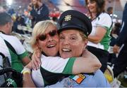 24 July 2015; Team Ireland’s Rita Quirke, a member of Moore Abbey Special Olympics Club, from Rathangan, Co Meath, with Garda sergeant Michaela Moloney, from Henry Street station, Limerick, and a member of the Law Enforcement Torch Run Team, during the opening ceremony of the Special Olympics World Summer Games. LA Memorial Coliseum, Los Angeles, United States. Picture credit: Ray McManus / SPORTSFILE