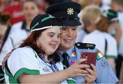 24 July 2015; Team Ireland’s Aoife O’Sullivan, a member of Owenabue Special Olympics Gymnastics Club, from Cork City, with Garda sergeant Michaela Moloney, from Henry Street station, Limerick, and a member of the Law Enforcement Torch Run Team, during the opening ceremony of the Special Olympics World Summer Games. LA Memorial Coliseum, Los Angeles, United States. Picture credit: Ray McManus / SPORTSFILE