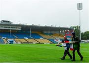 26 July 2015; Semple Stadium groundstaff Dave Hanley, left, and Aidan Dooley mark the pitch with flags at 10am ahead of the Electric Ireland GAA Hurling All-Ireland Minor Championship, Quarter-Final, Limerick v Galway. Semple Stadium, Thurles, Co. Tipperary. Picture credit: Piaras Ó Mídheach / SPORTSFILE