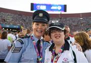24 July 2015; Team Ireland’s Lisa O’Brien, a member of COPE Foundation Cork, from Charleville, Co Cork, with Garda sergeant Michaela Moloney, from Henry Street station, Limerick, and a member of the Law Enforcement Torch Run Team, during the opening ceremony of the Special Olympics World Summer Games. LA Memorial Coliseum, Los Angeles, United States. Picture credit: Ray McManus / SPORTSFILE