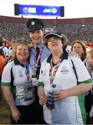 24 July 2015; Team Ireland’s Lisa O’Brien, a member of COPE Foundation Cork, from Charleville, Co Cork, with Garda sergeant Michaela Moloney, from Henry Street station, Limerick, and a member of the Law Enforcement Torch Run Team, band Julie Dwyer, left, during the opening ceremony of the Special Olympics World Summer Games. LA Memorial Coliseum, Los Angeles, United States. Picture credit: Ray McManus / SPORTSFILE