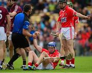 26 July 2015; Cork's Patrick Horgan is helped to his feet by referee James Owens after he was fouled. GAA Hurling All-Ireland Senior Championship, Quarter-Final, Galway v Cork. Semple Stadium, Thurles, Co. Tipperary. Picture credit: Piaras Ó Mídheach / SPORTSFILE