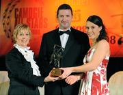 8 November 2008; Cathriona Foley, of Cork, is presented with her Camogie All-Star Award by President of the Camogie Association Liz Howard and Guest of Honour - Tipperary hurler - Brendan Cummins. Camogie All-Star Awards 2008 in association with O’Neills, Citywest Hotel, Conference, Leisure & Golf Resort, Dublin. Picture credit: Ray McManus / SPORTSFILE
