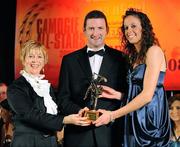 8 November 2008; Orla Cotter, of Cork, is presented with her Camogie All-Star Award by President of the Camogie Association Liz Howard and Guest of Honour - Tipperary hurler - Brendan Cummins. Camogie All-Star Awards 2008 in association with O’Neills, Citywest Hotel, Conference, Leisure & Golf Resort, Dublin. Picture credit: Ray McManus / SPORTSFILE