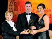 8 November 2008; Jessica Gill, of Galway, is presented with her Camogie All-Star Award by President of the Camogie Association Liz Howard and Guest of Honour - Tipperary hurler - Brendan Cummins. Camogie All-Star Awards 2008 in association with O’Neills, Citywest Hotel, Conference, Leisure & Golf Resort, Dublin. Picture credit: Ray McManus / SPORTSFILE