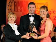 8 November 2008; Sile Burns, of Cork, is presented with her Camogie All-Star Award by President of the Camogie Association Liz Howard and Guest of Honour - Tipperary hurler - Brendan Cummins. Camogie All-Star Awards 2008 in association with O’Neills, Citywest Hotel, Conference, Leisure & Golf Resort, Dublin. Picture credit: Ray McManus / SPORTSFILE