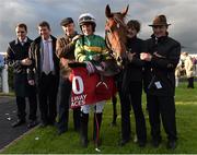 27 July 2015; Jockey Sarah O'Brien and winning connections celebrate after winning The McGettigan's Flat Race on Kalopsia. Galway Racing Festival. Ballybrit, Galway. Picture credit: Cody Glenn / SPORTSFILE