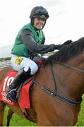 27 July 2015; Jockey Kate Harrington pats Modem after winning The Connacht Hotel (Q.R.) Handicap. Galway Racing Festival. Ballybrit, Galway. Picture credit: Cody Glenn / SPORTSF