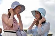 27 July 2015; Sisters Stephanie, left, and Rebecca Casserly, from Oranmore, Co. Galway, enjoying their evening at the races. Galway Racing Festival. Ballybrit, Galway. Picture credit: Cody Glenn / SPORTSFILE