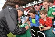 29 July 2015; Ireland head coach Joe Schmidt signs an autograph for Daniel Murray, from Cork City, after squad training. Irish Independent Park, Cork. Picture credit: Matt Browne / SPORTSFILE