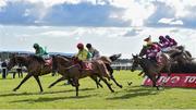29 July 2015; Shanahan's Turn, in second, with Jonathan Burke up, overtakes Baily Green, left, with Mark Enright up, who finished sixteenth, on their way to winning the thetote.com Galway Plate. Galway Racing Festival, Ballybrit, Galway. Picture credit: Cody Glenn / SPORTSFILE