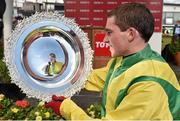 29 July 2015; Jockey Jonathan Burke admires thetote.com Galway Plate 2015 after winning the thetote.com Galway Plate on Shanahan's Turn. Galway Racing Festival, Ballybrit, Galway. Picture credit: Cody Glenn / SPORTSFILE