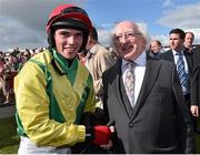 29 July 2015; Jonathan Burke is congratulated by The President of Ireland Michael D. Higgins after winning the thetote.com Galway Plate on Shanahan's Turn. Galway Racing Festival, Ballybrit, Galway. Picture credit: Cody Glenn / SPORTSFILE